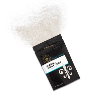 Classic kettle corn seasoning pouch laying on side with seasoning spilling out of top. Dell Cove Spices