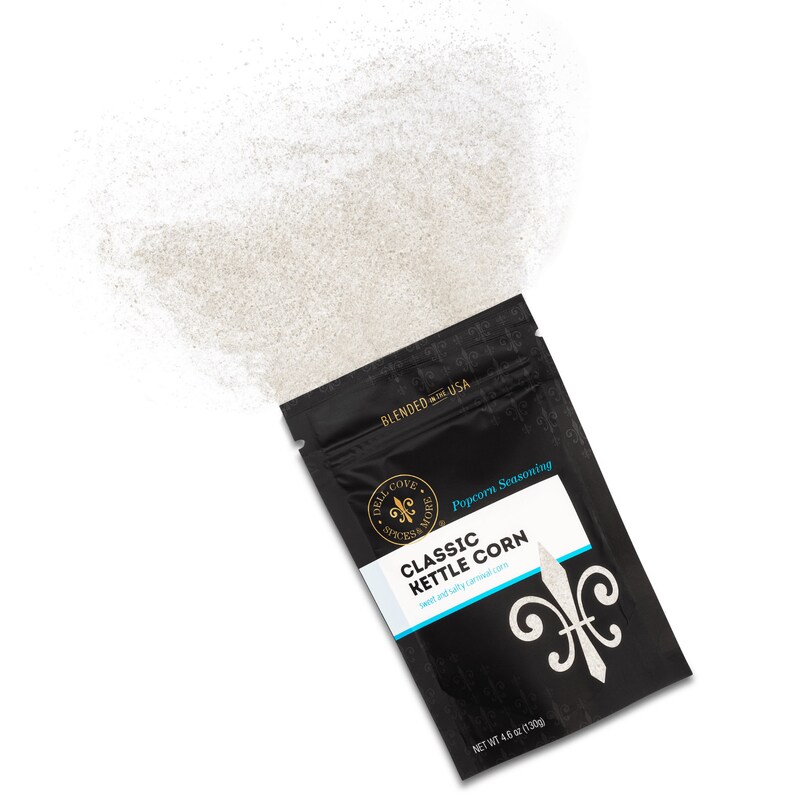 Classic kettle corn seasoning pouch laying on side with seasoning spilling out of top. Dell Cove Spices