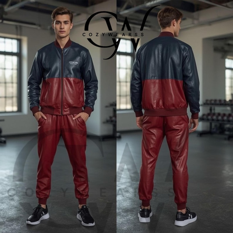 May include: A two-piece leather tracksuit in navy blue and burgundy. The jacket has a navy blue upper and burgundy lower section with a zipper closure. The pants are burgundy with an elastic waistband. The brand logo is visible on the jacket.
