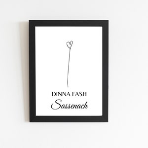 May include: Black and white framed print with a simple line drawing of a heart on a stem. The text "Dinna Fash Sassenach" is printed below the drawing.