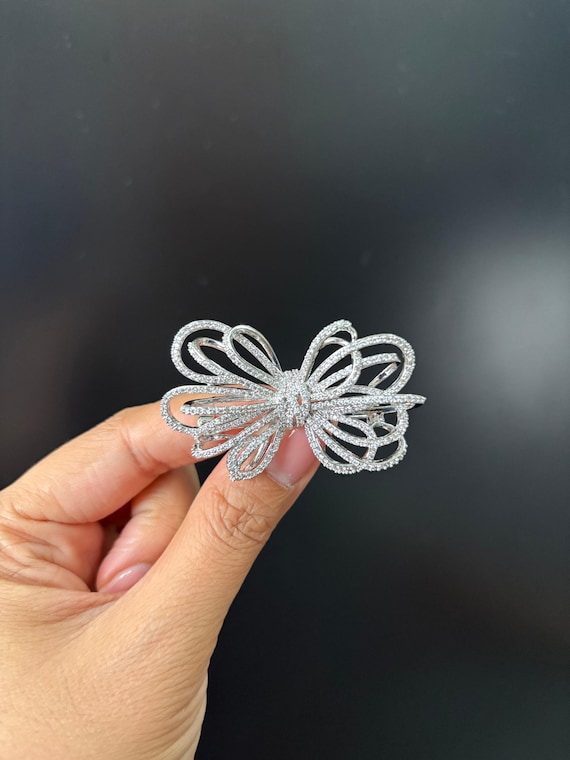 New Sparkling Silver Rhinestone Bow Brooch Sparkling Bow Brooch with Crystal Detail | Anne Klein main image 2