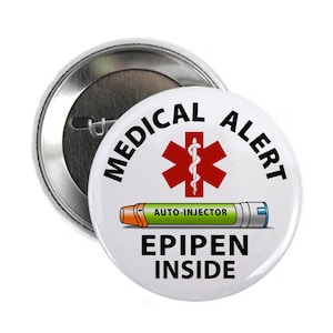May include: White button with a red star of life, a snake wrapped around a staff, and the text "MEDICAL ALERT". Below the star is a cartoon image of an EpiPen with the text "AUTO-INJECTOR" and "EPIPEN INSIDE".
