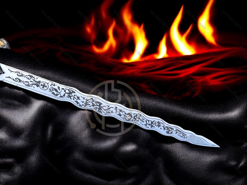 May include: A silver dagger with an ornate, etched design lies on a black surface, with a fiery background of red and orange flames. The dagger's blade features intricate patterns and a cross symbol.