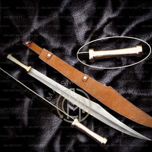 May include: A collection of swords with silver blades and gold handles, alongside a brown leather sheath. The swords are displayed on a textured black surface. One sword is unsheathed, and another is partially drawn.
