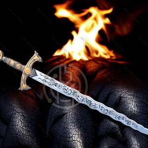 May include: An ornate sword with a silver blade and gold hilt, featuring intricate engravings. The hilt has a red gem at the pommel. Flames are in the background, set against a dark, textured surface. A decorative item.