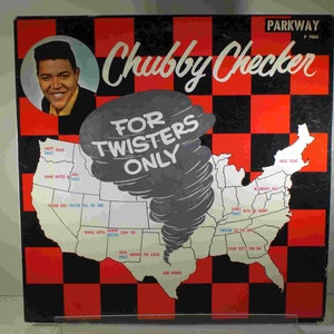 May include: A black and red checkered background with a white outline of the United States. A gray tornado is in the middle of the map. The text "Chubby Checker" is in a white cursive font at the top of the image. The text "For Twisters Only" is in white block letters below the tornado. The text "Night Train Twist", "Shake Rattle & Roll Twist", "Hound Dog Twistin' All The Time", "Whole Lotta Shakin' Goin' On Twistin", "Rock Around The Clock Twist", "Dance With My Henry Twist", "Twistin' At The Hop", "Your Feet's Too Big", "Blueberry Hill", "Hold Tight", and "And Others" are written in blue and black text on the map.