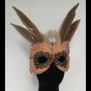 Pumpkin Spice Feather Mask on Suede is the perfect mask for you add to your costume to go party and dance.