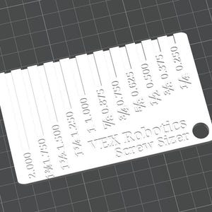 May include: A white VEX Robotics screw sizer tool with measurements in inches. The tool has a series of slots labeled with fractional and decimal inch measurements, ranging from 1/4 to 2.000 inches. It includes a hole for easy storage.