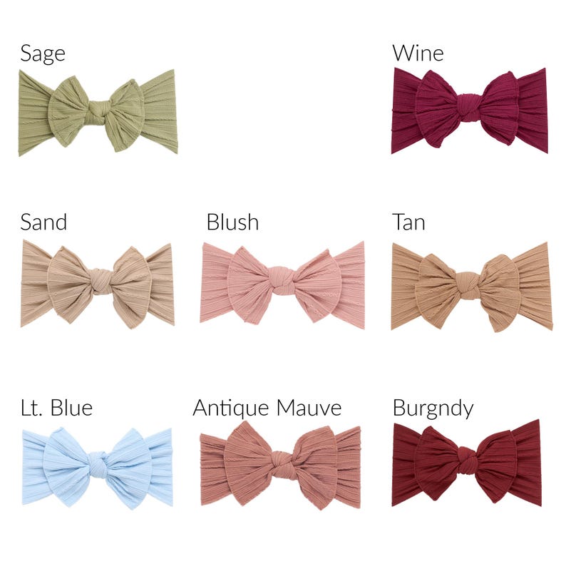 May include: A collection of eight ribbed fabric headbands, each featuring a central knotted bow design. The colors displayed are labeled as Sage, Wine, Sand, Blush, Tan, Lt. Blue, Antique Mauve, and Burgndy, arranged in a grid format.