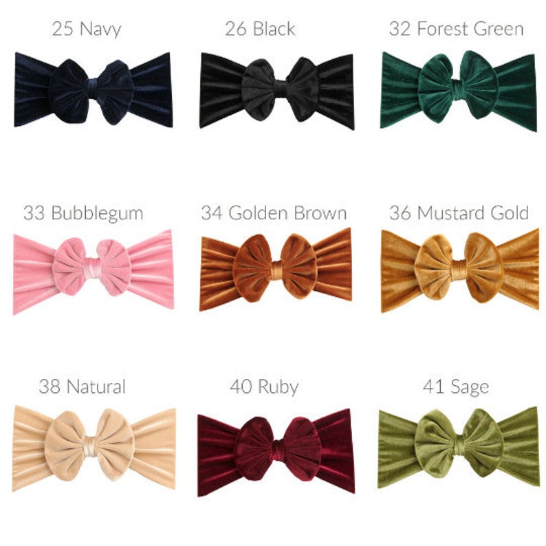 May include: Nine velvet headbands in various colors, including navy, black, forest green, bubblegum pink, golden brown, mustard gold, natural, ruby, and sage. Each headband features a large, knotted bow.