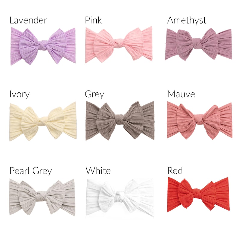 May include: A collection of nine ribbed fabric headbands with knotted bow centers, displayed in a grid. Colors include lavender, pink, amethyst, ivory, grey, mauve, pearl grey, white, and red, each labeled with its corresponding color name.