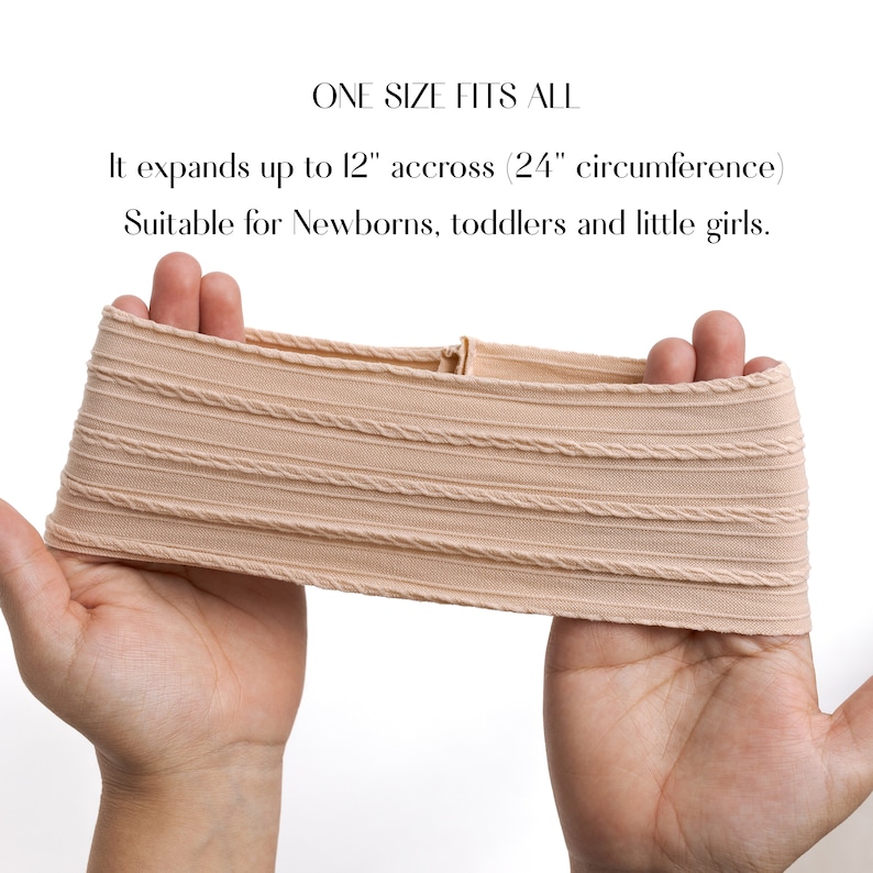 May include: A beige stretchy headband with a ribbed texture. It expands up to 12 inches across and has a 24 inch circumference.  "ONE SIZE FITS ALL" and "Suitable for Newborns, toddlers and little girls." are written in black text.