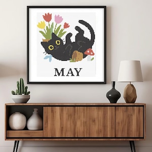 Cross stitch pattern set of 12 seasonal black cats, each in a unique monthly theme with flowers, costumes, or accessories. PDF digital download for embroidery lovers.