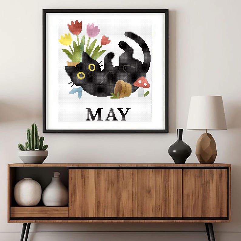 Cross stitch pattern set of 12 seasonal black cats, each in a unique monthly theme with flowers, costumes, or accessories. PDF digital download for embroidery lovers.