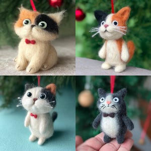 May include: Four handmade cat ornaments. Each cat is made of felt and features a unique color pattern, including calico, tuxedo, and orange tabby designs. Each cat wears a small red bow tie and has a red hanging loop.