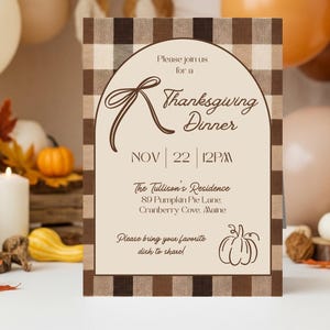 May include: Thanksgiving dinner invitation with a brown plaid border. The invitation features the text "Please join us for a Thanksgiving Dinner" and details for the event, including the date, time, and location. A pumpkin illustration is at the bottom.