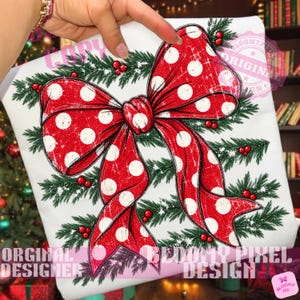 May include: A white fabric surface featuring a large red bow with white polka dots, layered over green pine branches and small red berries. The design has a distressed texture and includes the text ORIGINAL DESIGN and BLOOMY PIXEL DESIGN.