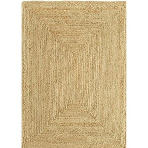 May include: Rectangular jute rug with a natural, light brown color. The rug features a woven design with a rectangular border and a central square pattern. The rug is suitable for indoor use.