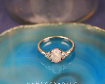 Oval Lab Opal Ring in Sterling Silver: Delicate CZ Stone