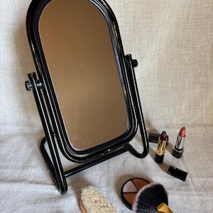 Vintage 1980s vanity mirror on a stand