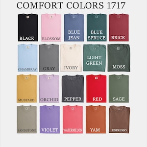 a bunch of different colors of shirts on a white background