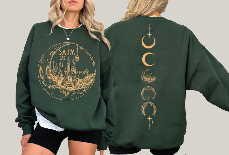 A woman wearing a green sweatshirt with a gold design on the front and back.