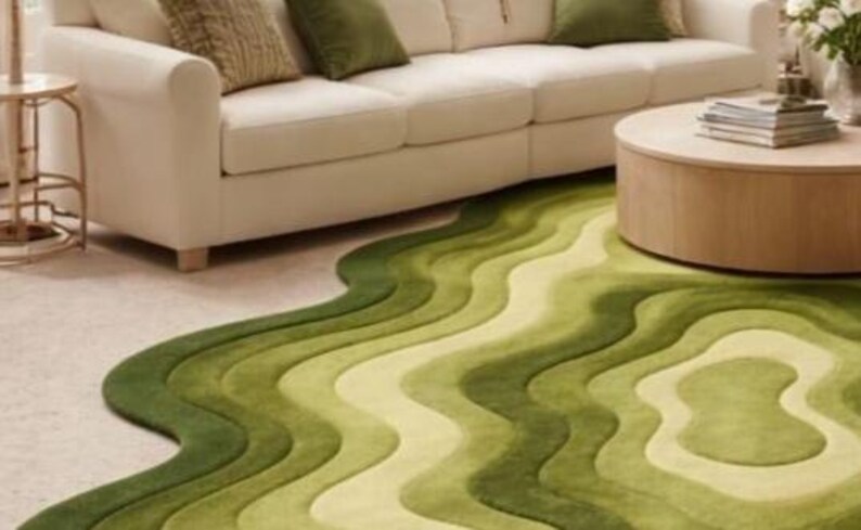 Topographic layered green area rug shown in a spacious classical interior. Wavy organic shape with multiple contour layers in deep and light green tones, resembling terrain elevation. Plush tufted texture, modern artistic floor decor for living rooms or luxury spaces.