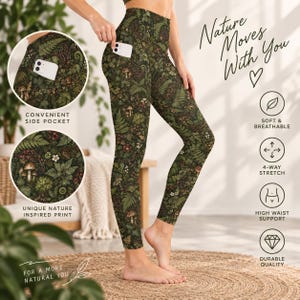May include: High-waisted leggings featuring a dark green botanical print with mushrooms, ferns, and small flowers. The leggings include a side pocket and text that reads Nature Moves With You, Convenient Side Pocket, and Unique Nature Inspired Print.