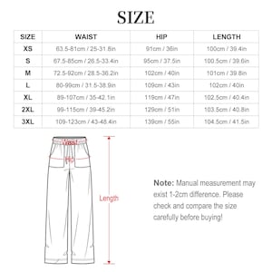 Size chart image for pants, showing measurements in centimeters and inches for waist, hip, and length from XS to 3XL. Includes a pants diagram with measurement labels. Note about possible 1-2 cm variance.