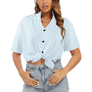 May include: Light blue plaid button-up shirt with short sleeves. The shirt features a classic collar, black buttons, and a tied front. The plaid pattern includes light blue and dark blue lines, creating a checkered design.