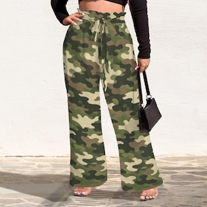 May include: Wide-leg camouflage print pants in shades of green, brown, and beige. The high-waisted pants feature a drawstring tie and a gathered waistband. The pants are made of a lightweight fabric.