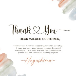 May include: A white card with the words "Thank You" in elegant script, with a heart symbol replacing the "o" in "You." The text "DEAR VALUED CUSTOMER," is below. Watercolor paint strokes in peach, green, and blue accent the corners.
