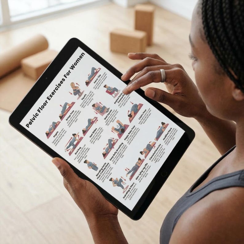 May include: A black tablet displaying "Pelvic Floor Exercises For Women" with various exercise illustrations. The tablet is held by a person wearing a gray tank top. Exercise diagrams include Kegels, Bridge Pose, and Happy Baby Pose.