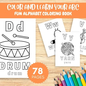 May include: A children's colouring book with the text "COLOR AND LEARN YOUR ABC" and "FUN ALPHABET COLOURING BOOK". The book features black and white illustrations of objects like a drum, yarn, and violin, with the corresponding letters and words.