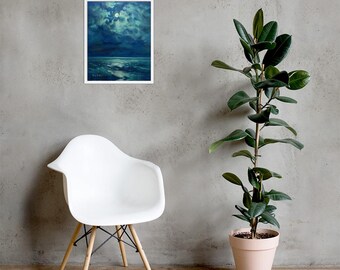 May include: A framed art print depicting a moonlit seascape with dark blue and teal hues. The artwork features a bright full moon, clouds, and the ocean. A white chair and a potted plant are in the foreground.