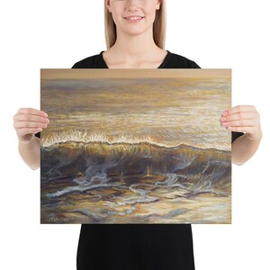 May include: An ocean wave painting in shades of gold, brown, and blue. The artwork depicts a breaking wave with foamy white crests under a golden sky. The painting captures the movement and light of the sea.