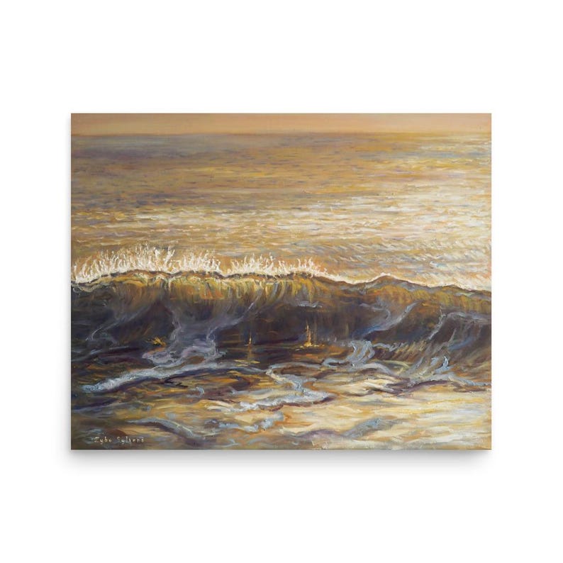 May include: An oil painting depicts a wave cresting in the ocean. The artwork features shades of gold, brown, and blue, with the wave's foamy crest illuminated by sunlight. The artist's signature is visible in the lower left corner.