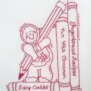 Może przedstawiać: Czerwony haft przedstawiający piernikowego ludzika trzymającego ołówek, nad którym ułożone są dwie książki. Książki są zatytułowane "Gingerbread Recipes" i "Easy Cookies".