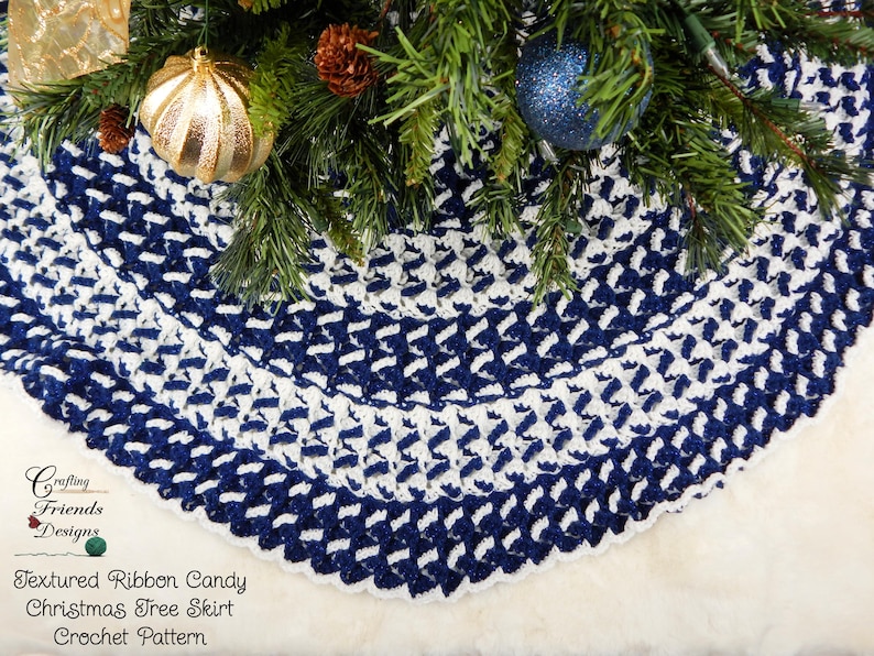 May include: A blue and white crocheted Christmas tree skirt with a textured ribbon candy design. The skirt is made with a combination of single crochet and double crochet stitches. "Crafting Friends Designs" and "Textured Ribbon Candy Christmas Tree Skirt Crochet Pattern" are written on the white background.