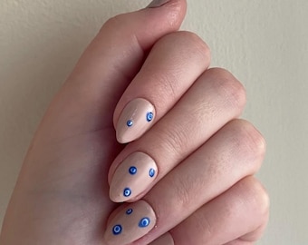 Mau-olhado Press nas unhas