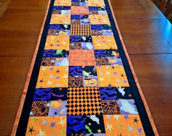 Handmade Quilted Halloween Patchwork Table Runner with large scale halloween print for backing.