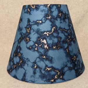 Denim color, navy blue with metallic streaks lamp shade. metallic Cracks.  Shade is 9.5 wide at the bottom, 5&quot; wide at the top and 7&quot; tall