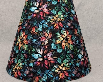 Fabric!  Stained glass look lamp shade. Flowers.  Colorful.  Tiles. Realistic. Blue,red, yellow, green.  Shades are 9.5" x 5" x 7" tall