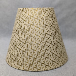 Golden metallic retro look lamp shade.  Metallic. Gold. Shade is 9.5 wide at the bottom, 5" wide at the top and 7" tall