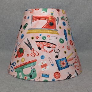 Sewing lamp shade. Pink.  Sewing machine, scissors, needle, thread... Shades are 9.5" x 5" x 7" tall