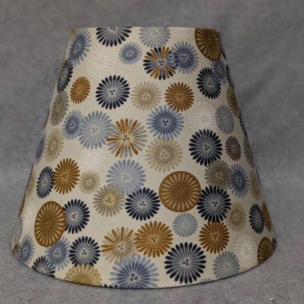 Colorful abstract lamp shade.  Bursts, flowers, dots.  Shade is 9.5 wide at the bottom, 5" wide at the top and 7" tall