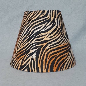 Tiger stripes print lamp shade.  Safari.   Shades are 9.5" wide at the bottom, 5" at the top and 7" tall