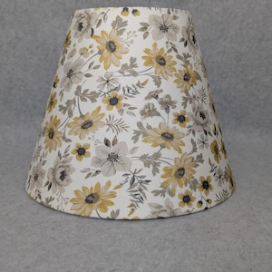 White and Yellow flowers lamp shade.  Leaves, leaf. White background.  Shades are 9.5&quot; x 5&quot; x 7&quot; tall
