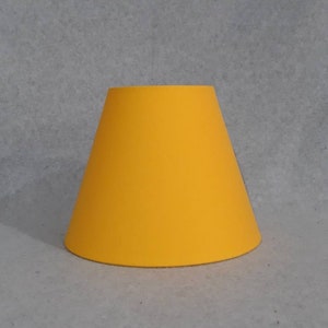 Yellow lamp shade.  Solid color.  Shade is 9.5 wide at the bottom, 5&quot; wide at the top and 7&quot; tall