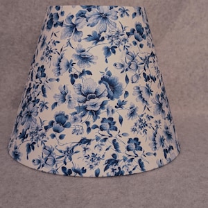 Blue Flowers on white lamp shade.  Blue and white.  Plants.  Flowers.  Accent shade.  Shades are 9.5&quot; x 5&quot; x 7&quot; tall